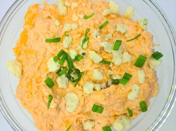 recipe for buffalo chicken dip with cream cheese in glass bowl
